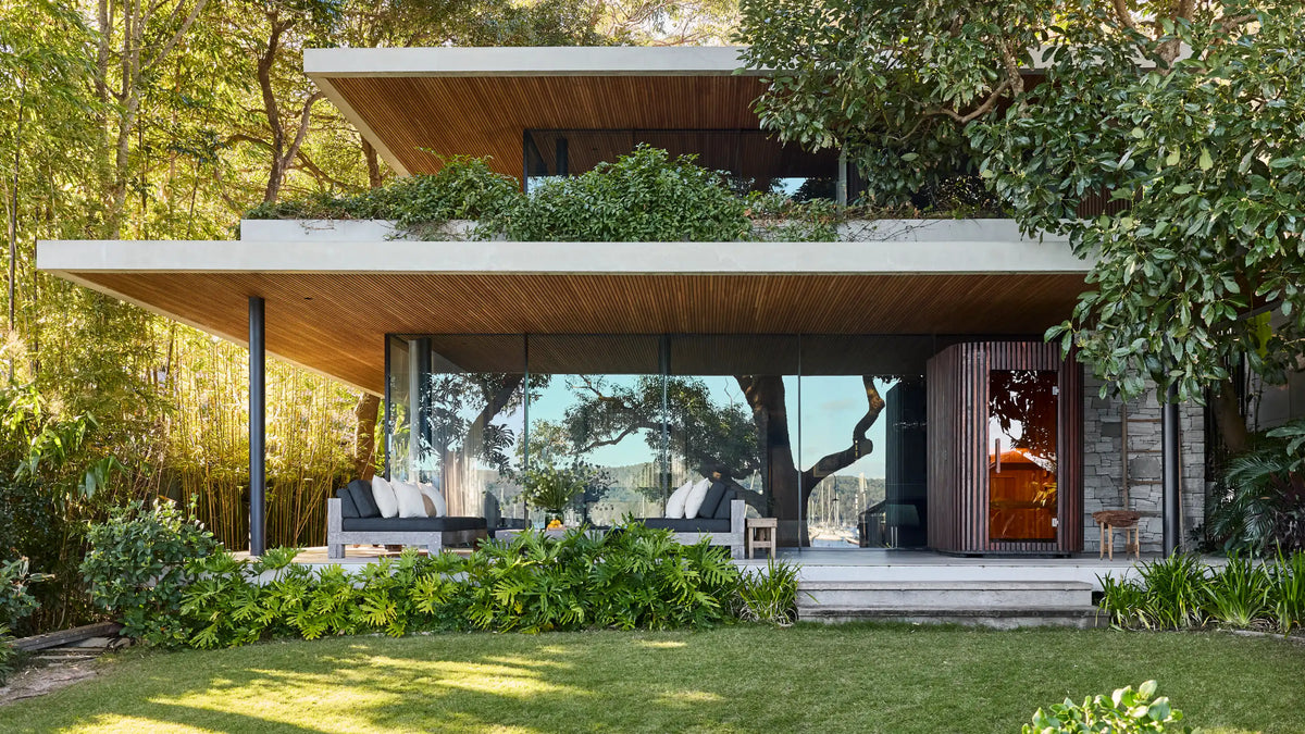 Elata set within a garden-facing terrace, surrounded by trees and greenery