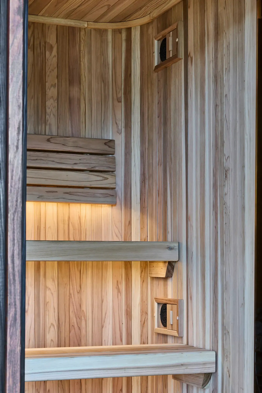 Timber benches, softly lit backrest and ventilation inside Elata