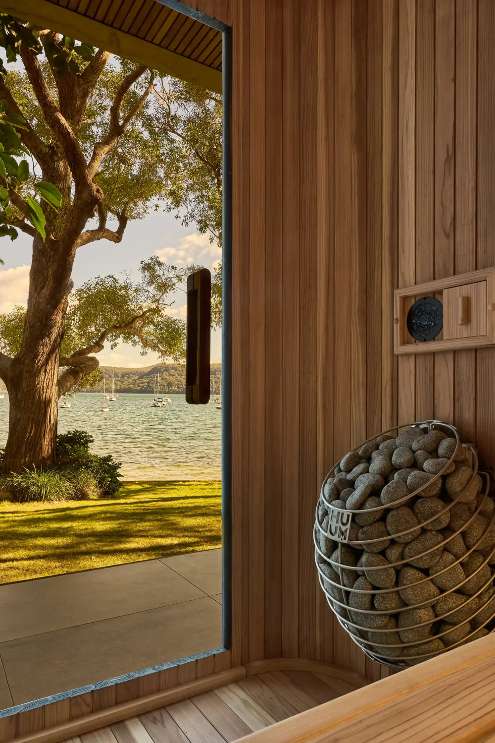 HUUM Drop heater beside Elata’s open door overlooking the water